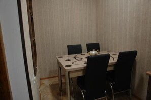 Enjoy meals in this stylish dining area with a round table and four comfortable chairs.