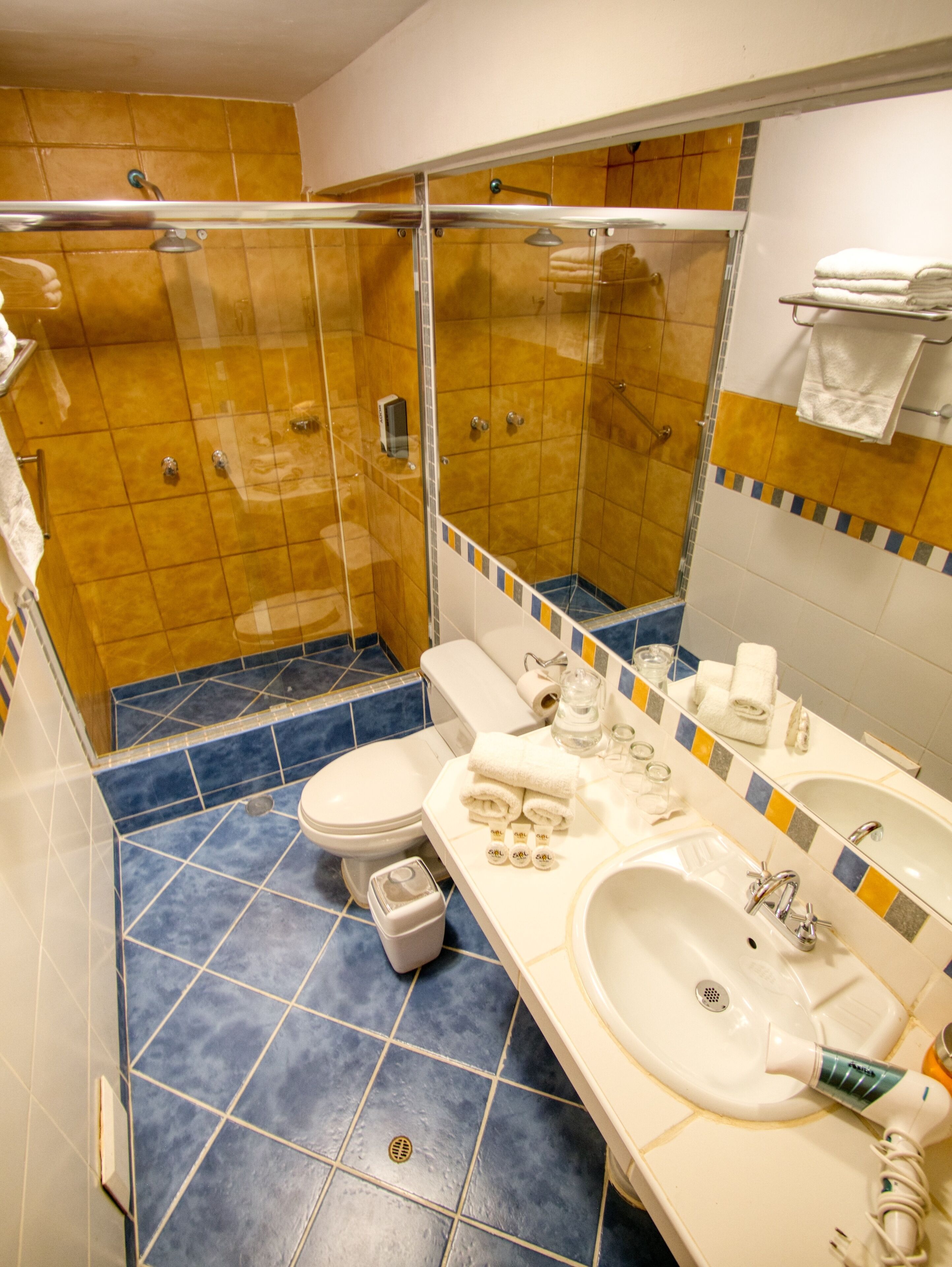 shower, rainfall showerhead, hair dryer, towels