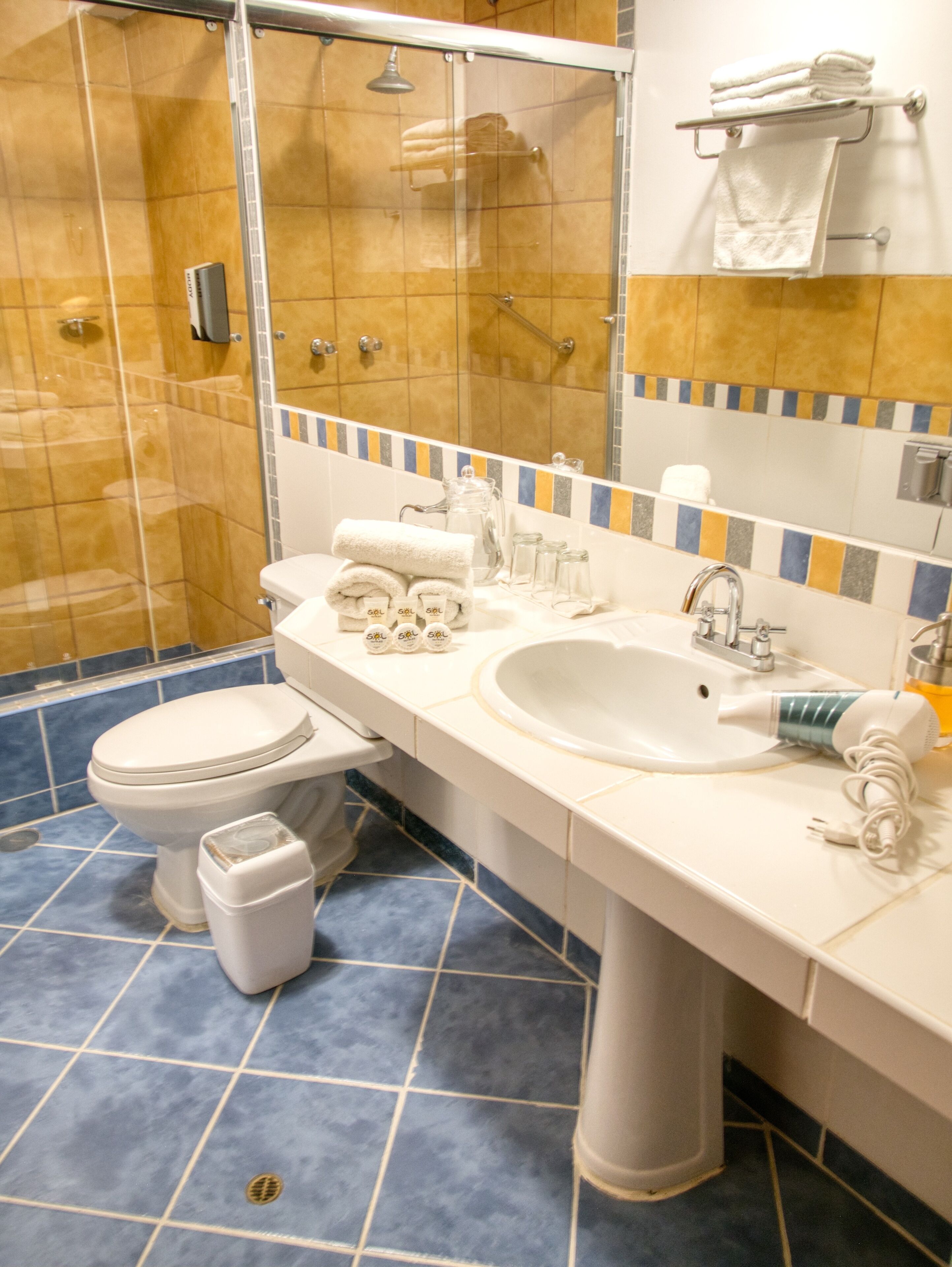 shower, rainfall showerhead, hair dryer, towels