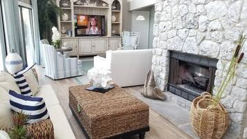 House, Multiple Beds, Balcony, Partial Ocean View | Living room | TV