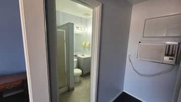 Room, 1 King Bed, Non Smoking, Kitchenette | Bathroom | Free toiletries, towels, soap, shampoo