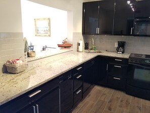 Condo, Multiple Beds, Balcony, Ocean View | Private kitchen | Fridge, microwave, stovetop, dishwasher