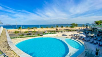 Outdoor pool, open 9:00 AM to 9:00 PM, pool umbrellas, pool loungers