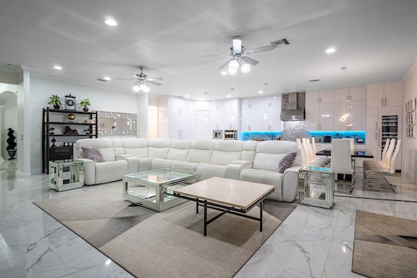 Brand new white leather reclining couches with seating for 11