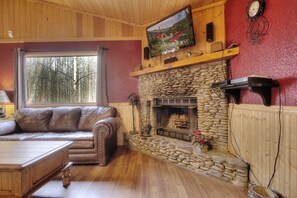 42-inch TV with cable channels, fireplace