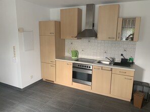 Fridge, stovetop, coffee/tea maker, electric kettle