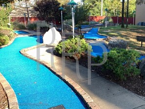 Relax by the serene pool surrounded by lush gardens and a tranquil atmosphere.
