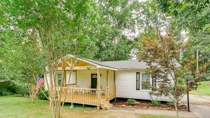 A mobile home with a wooden porch, a small deck, and a front door. - Down town Travelers rest walking to swamp rabbit bike trail  (Travelers Rest)