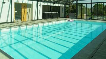 Indoor pool, open 10:00 AM to 10:30 PM, pool loungers