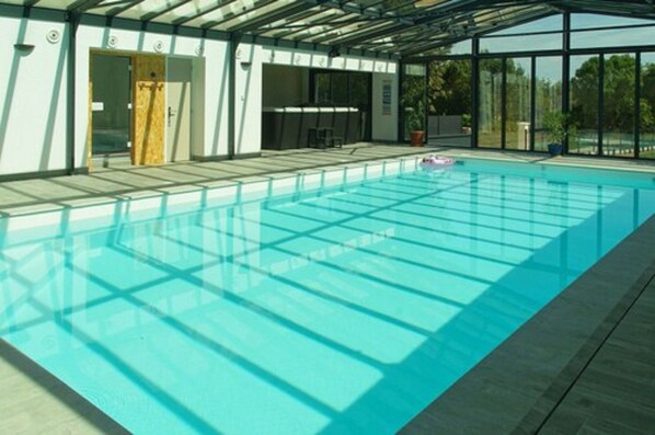 Indoor pool, open 10:00 AM to 10:30 PM, pool loungers