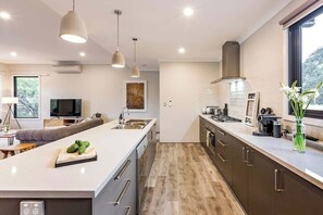 Coffee/tea maker, fridge, microwave, oven