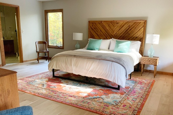 Master bedroom with separate sitting area / recliner, view of waterfall