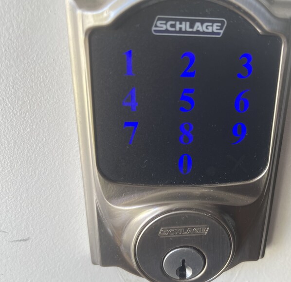 A SCHLAGE numeric keypad lock. - Adorable House with fireplace in backyard (Santa Clarita)