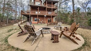 A cabin with a deck, outdoor seating, and a fire pit. - Daze Off- Spectacular Views | Large Hot Tub | Outdoor Fire Pit (Morganton)