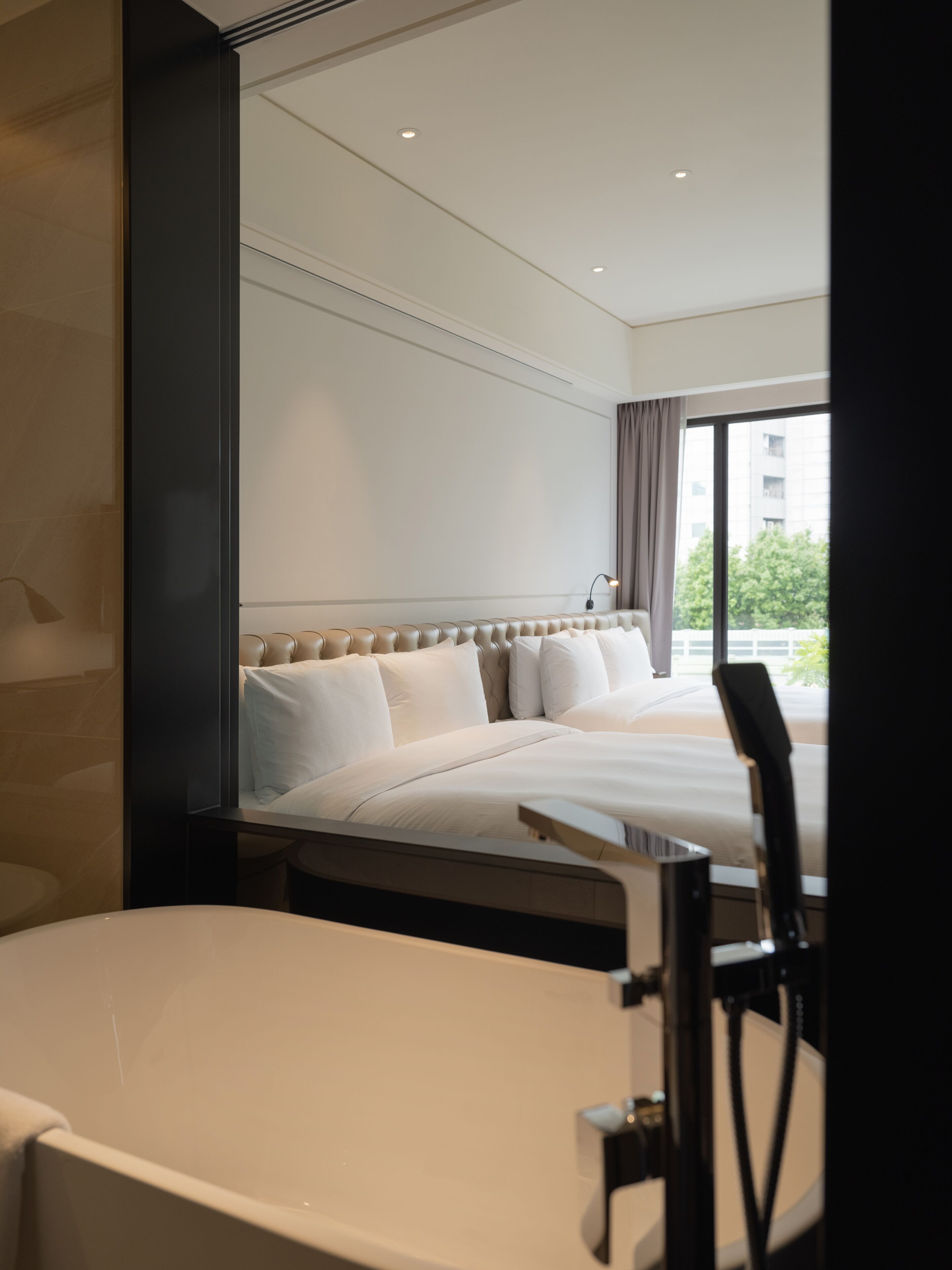 the studio, 2 queen beds | bathroom | hair dryer, bathrobes, slippers, electronic bidet