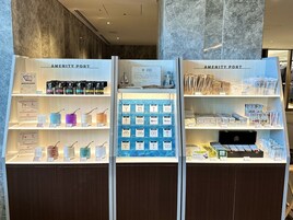 A display of beauty and wellness products at a hotel, including various skincare items and accessories.