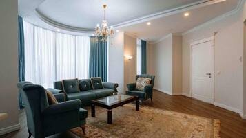 Suite, 1 King Bed, Non Smoking (VIP Suite) | Living area | 40-inch flat-screen TV with cable channels, TV, heated floors