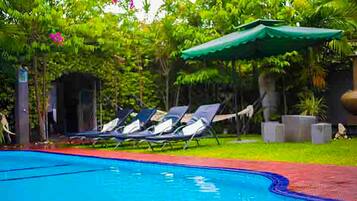 Outdoor pool, open 6:00 AM to 9:30 PM, pool umbrellas, pool loungers
