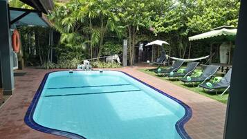 Outdoor pool, open 6:00 AM to 9:30 PM, pool umbrellas, pool loungers