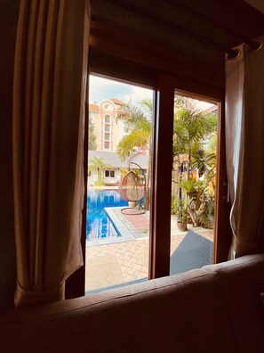 Deluxe Double Room, Bathtub, Pool View | Premium bedding, in-room safe, individually decorated - Paradise Land Resort (Pattaya)