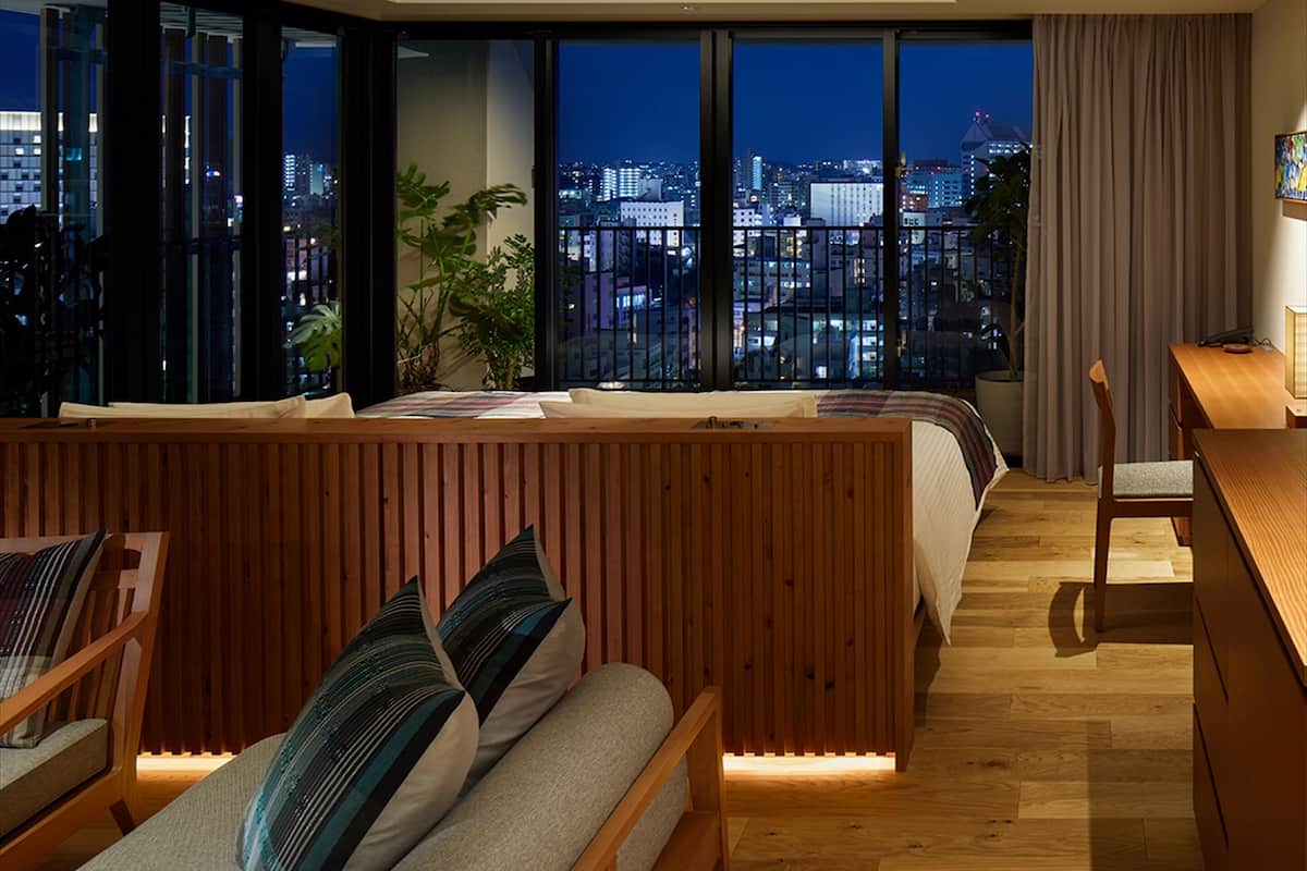 deluxe corner twin (with 1 sofa bed) | living area | 40-inch tv with digital channels