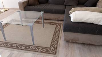 Apartment, Terrace | Living area | 43-inch flat-screen TV with satellite channels, Smart TV, Netflix