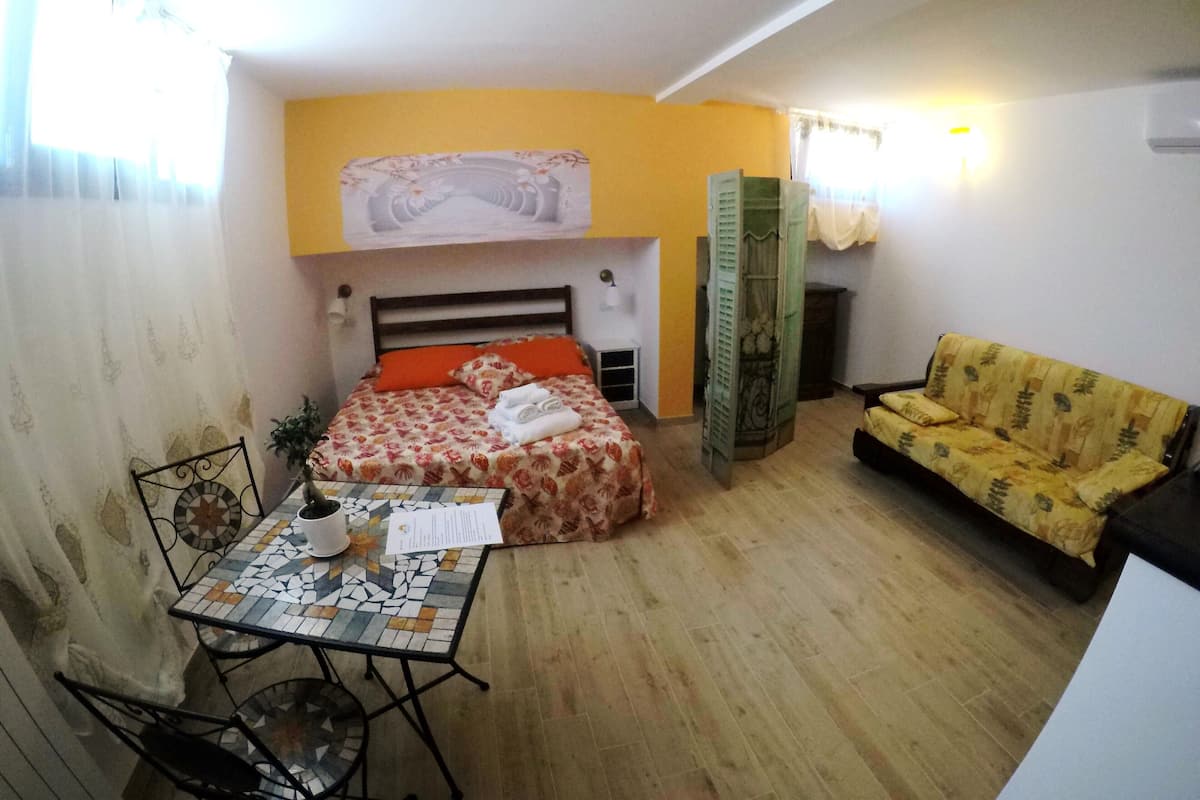 Chambre Quadruple Deluxe | Coin séjour