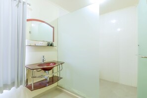Deluxe Double Room | Bathroom | Shower, towels - OYO 1684 Marina Suite Apartment Bali (Denpasar)