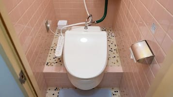 Separate bathtub and shower, free toiletries, hair dryer, slippers