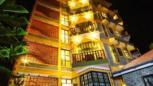 A multi-story building with balconies and large windows, likely a hotel or residential building. - Olive Resort (Naivasha)