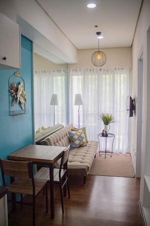 Deluxe Condo, 1 Double Bed with Sofa bed | Living area | Flat-screen TV