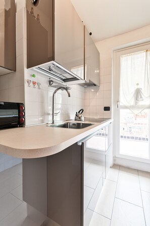 Apartment, 1 Bedroom | Private kitchen | Full-sized fridge, oven, stovetop, cookware/dishes/utensils