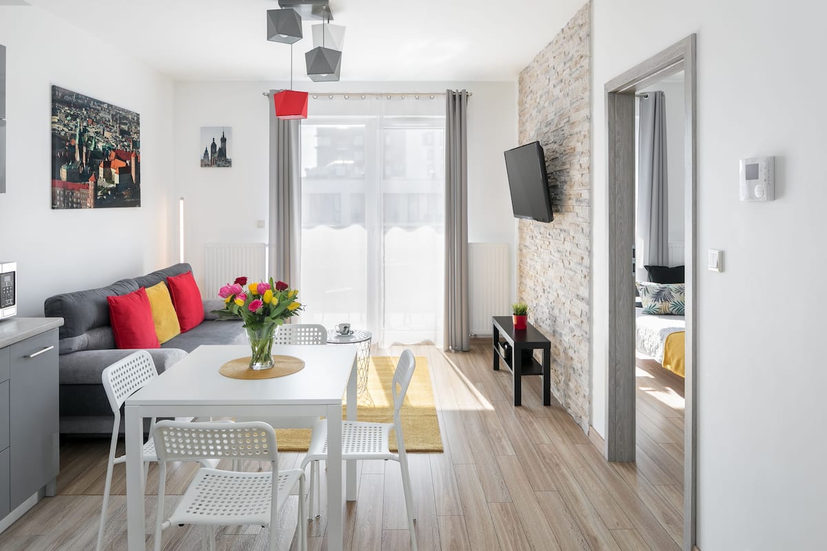 Family Apartment, 1 Bedroom, Balcony (Rakowicka 22H st.) | Living room | 42-inch flat-screen TV with cable channels, TV