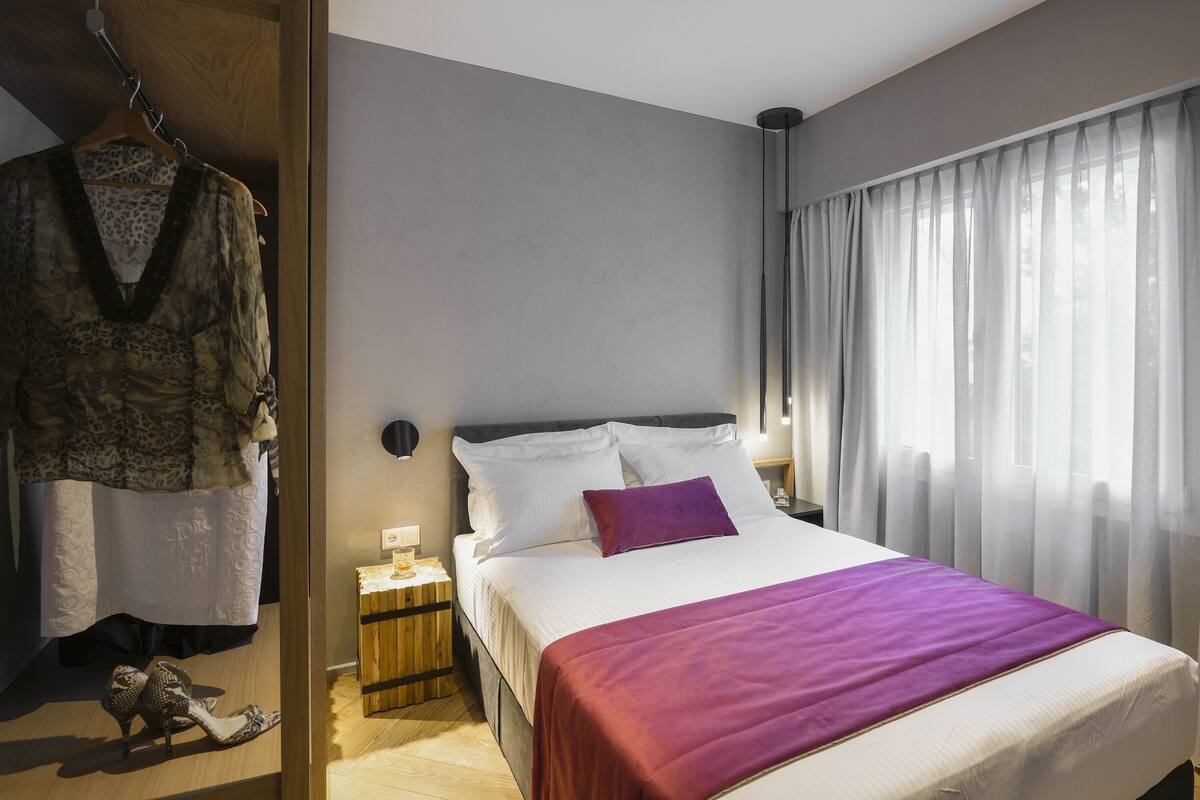 Apartment (Euphoria Suite) | 1 bedroom, desk, laptop workspace, iron/ironing board
