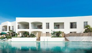 Indoor pool, outdoor pool, pool umbrellas, pool loungers