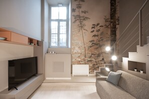 Appartement, 1 chambre | Salle de séjour | Télévision à écran plat