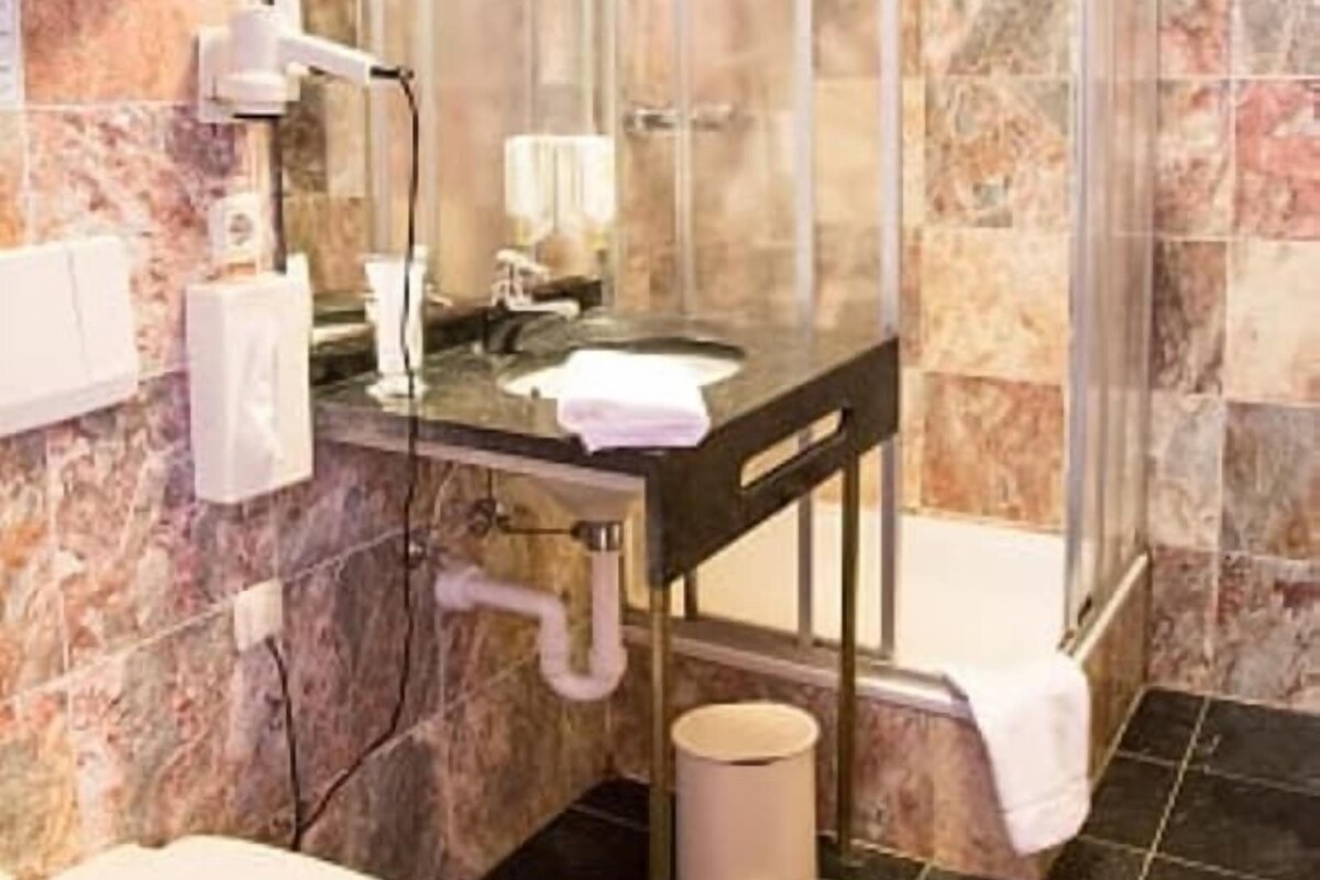 Bathroom | Hair dryer, slippers, towels
