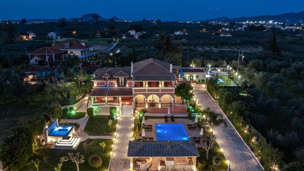A large, multi-story house with a swimming pool and a well-maintained garden. - Amalthia Villa (Zakynthos)