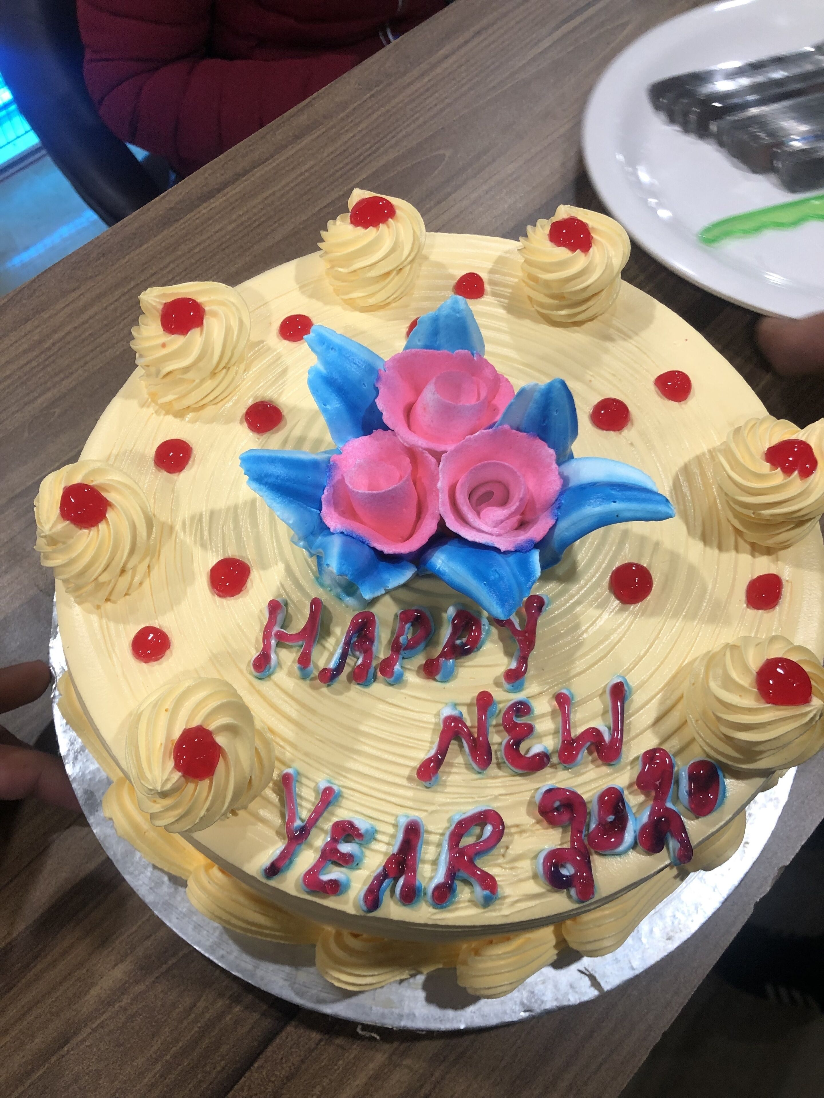 A cake with 'HAPPY NEW YEAR 2020' written on it.