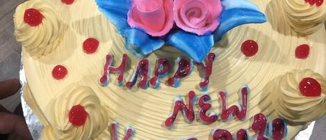 A cake with 'HAPPY NEW YEAR 2020' written on it.