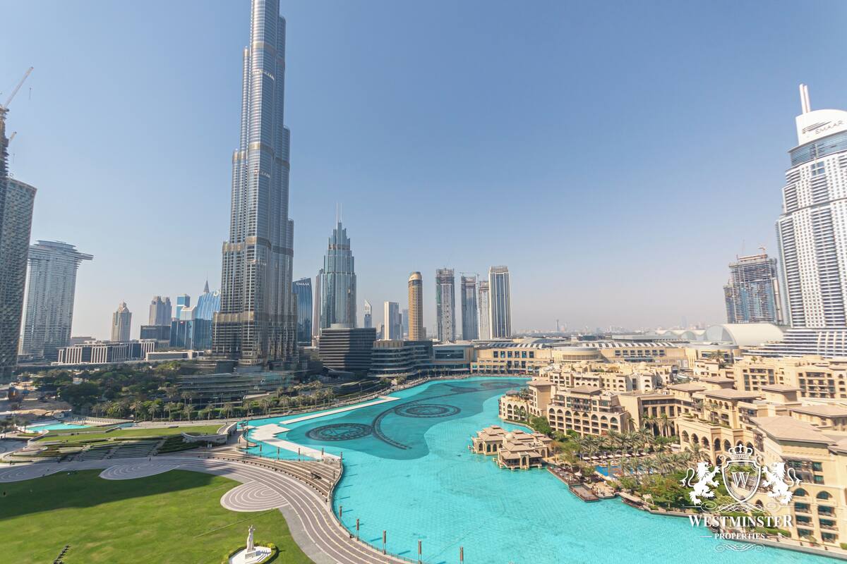 A cityscape with a prominent skyscraper, a waterfront area, and a mix of modern and traditional architecture.