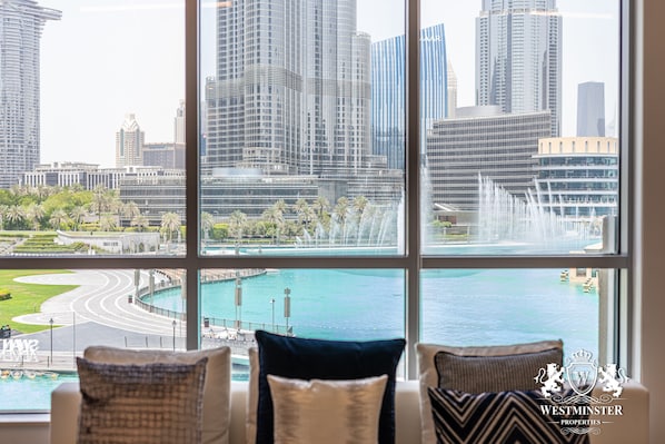 Three bedroom with Full Burj Khalifa and fountain view - Natasha Rox Design | Living area | Flat-screen TV