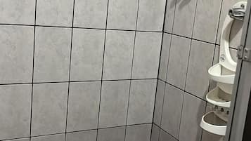 Shower, rainfall showerhead, hair dryer, towels