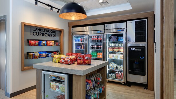 A kitchenette with a refrigerator, a freezer, a microwave, and a coffee machine. - Candlewood Suites DFW West - Hurst by IHG (Hurst)
