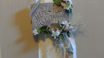 Welcome to our home, where a beautiful floral arrangement greets you at the door.