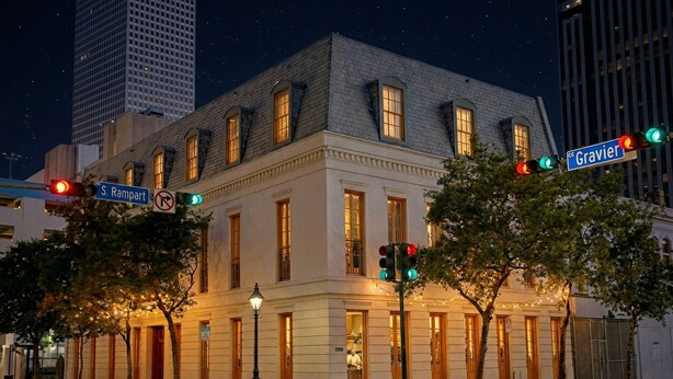 A historic building with a classic architectural style, located at the intersection of S. Rampart and Gravier streets. - The Louie Hotel New Orleans, Belvilla District 6 Formerly Sonder (New Orleans)