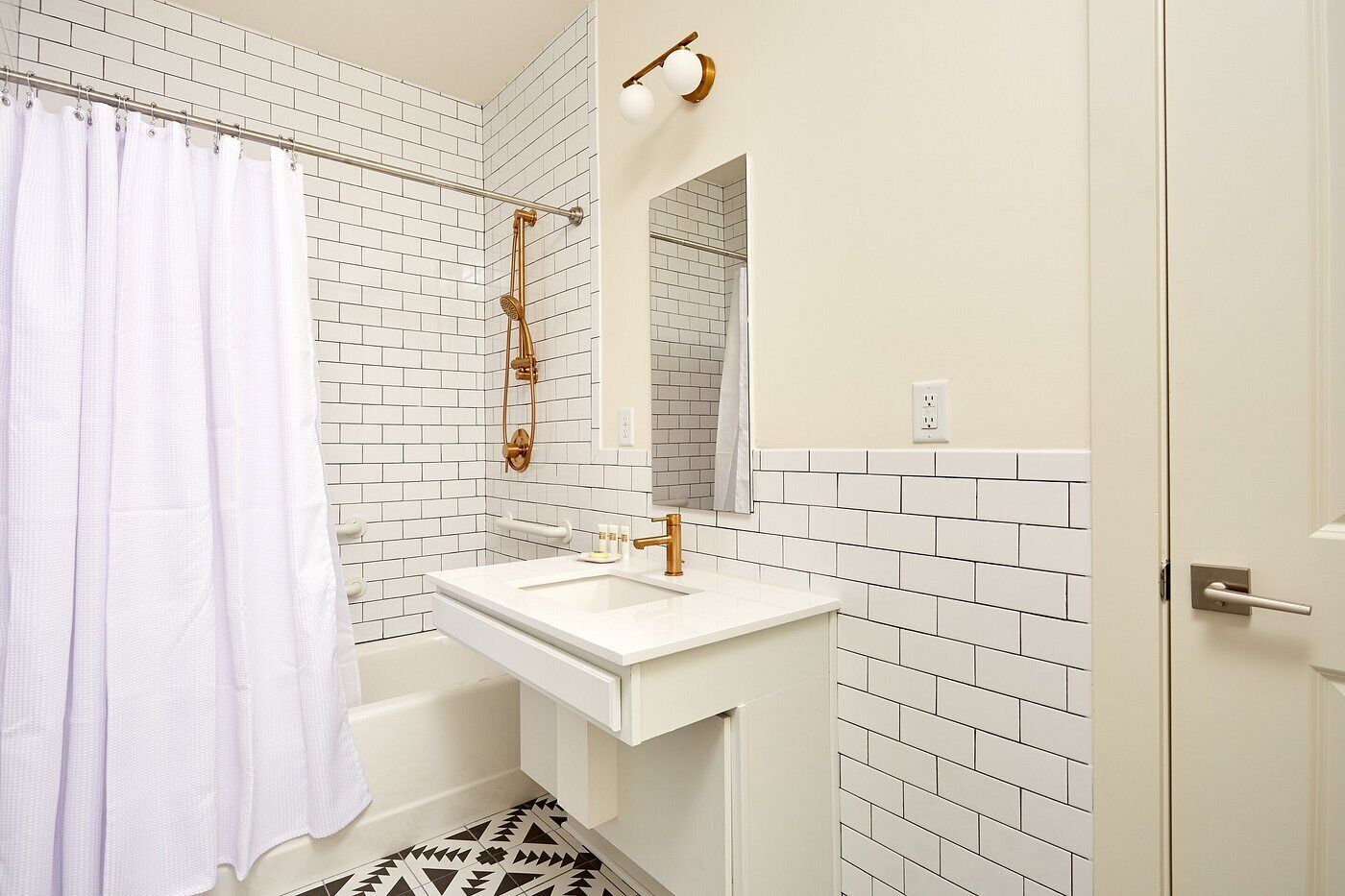 Designer toiletries, hair dryer, towels