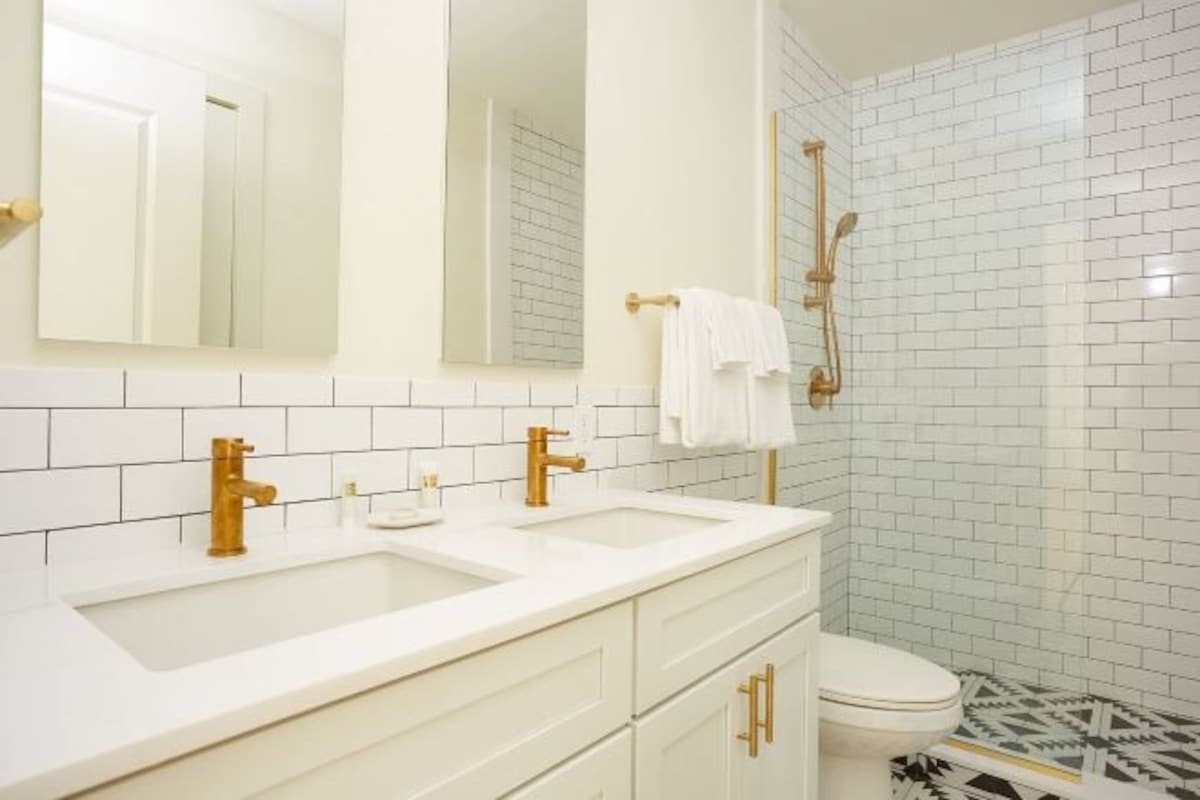 Designer toiletries, hair dryer, towels