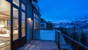 A modern building with large windows and a balcony overlooking a snowy mountain landscape. - Stunning 4-Bedroom Private Penthouse Villa With Panoramic Views (Mountain Village)