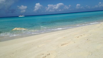 On the beach, sun loungers, beach towels